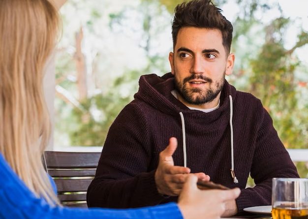 Man talking woman table outdoors 23 2147805513