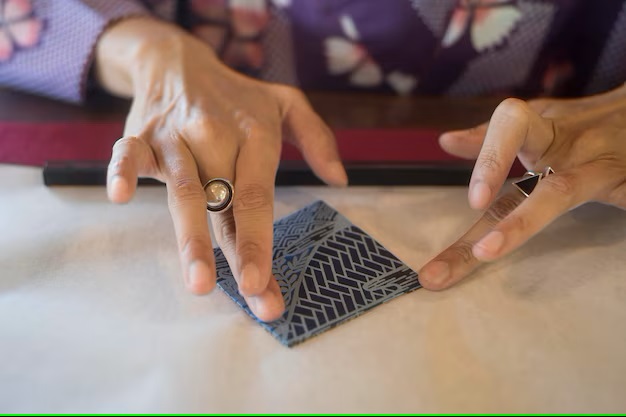 Woman making origami with japanese paper 23 2149048361