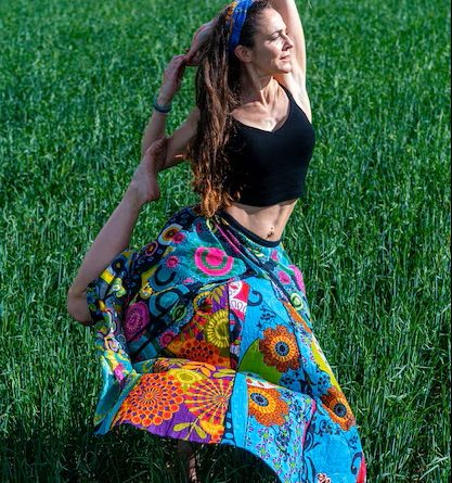 Young woman floral dress meditating grass field 181624 40970